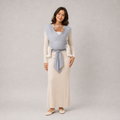 Parent carrying a newborn in the Embrace baby wrap carrier — NAEVII