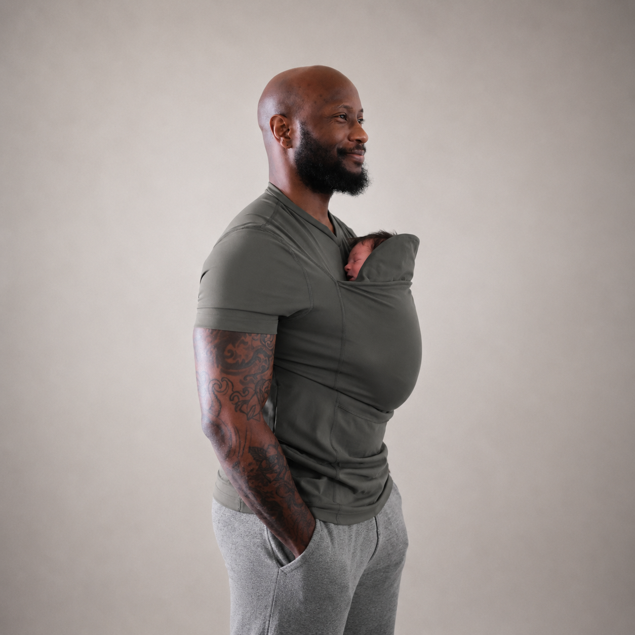 Dad carrying newborn in the Nesting Dad Shirt — NAEVII
