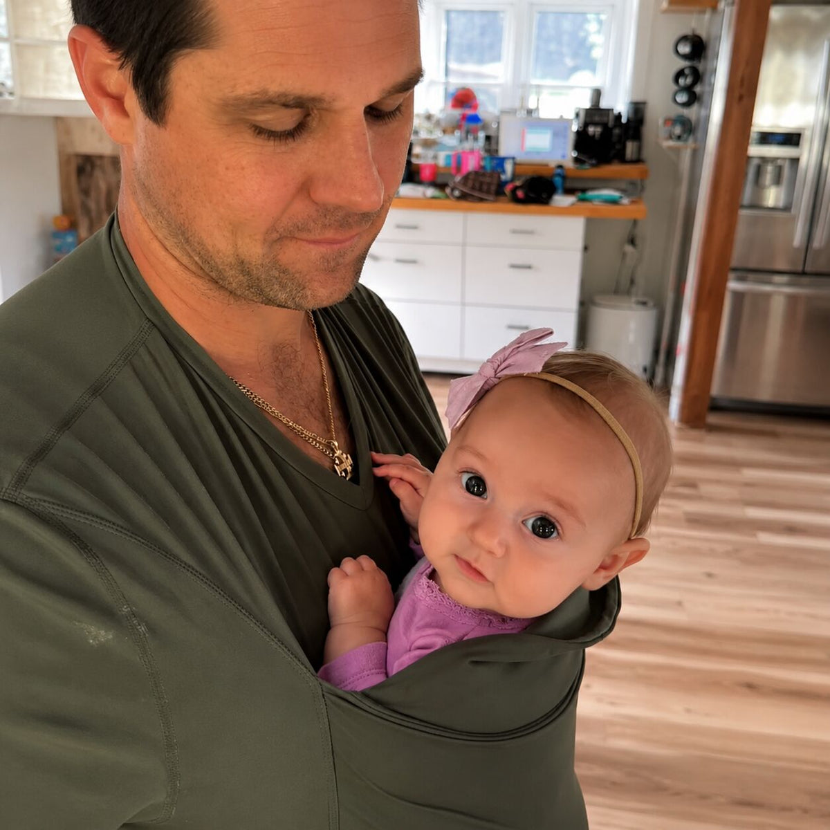 Dad holding baby close