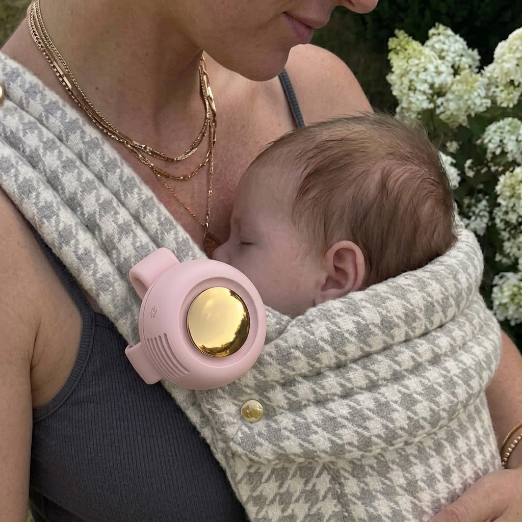 NAEVII Bladeless Pocket Fan in pink clipped to a baby carrier strap while baby sleeps#Color_Pink