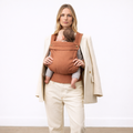 Woman carrying newborn in NAEVII Soft Baby Carrier, Brown, front carry#Color_Brown