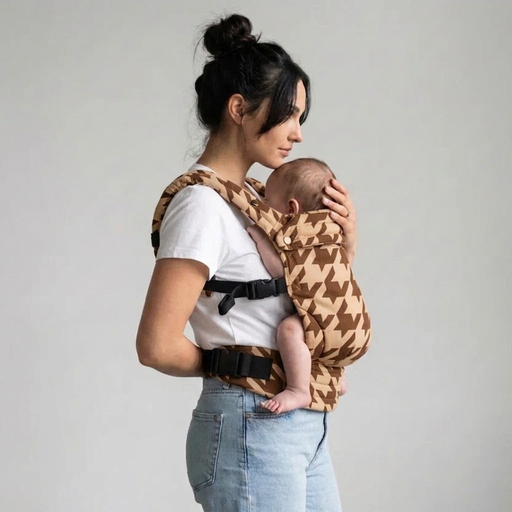 Woman carrying newborn in NAEVII Soft Baby Carrier, brown Mocha Houndstooth, front carry#Color_Mocha Houndstooth