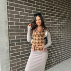 Woman carrying newborn outdoors in NAEVII Soft Baby Carrier, brown Mocha Houndstooth#Color_Mocha Houndstooth