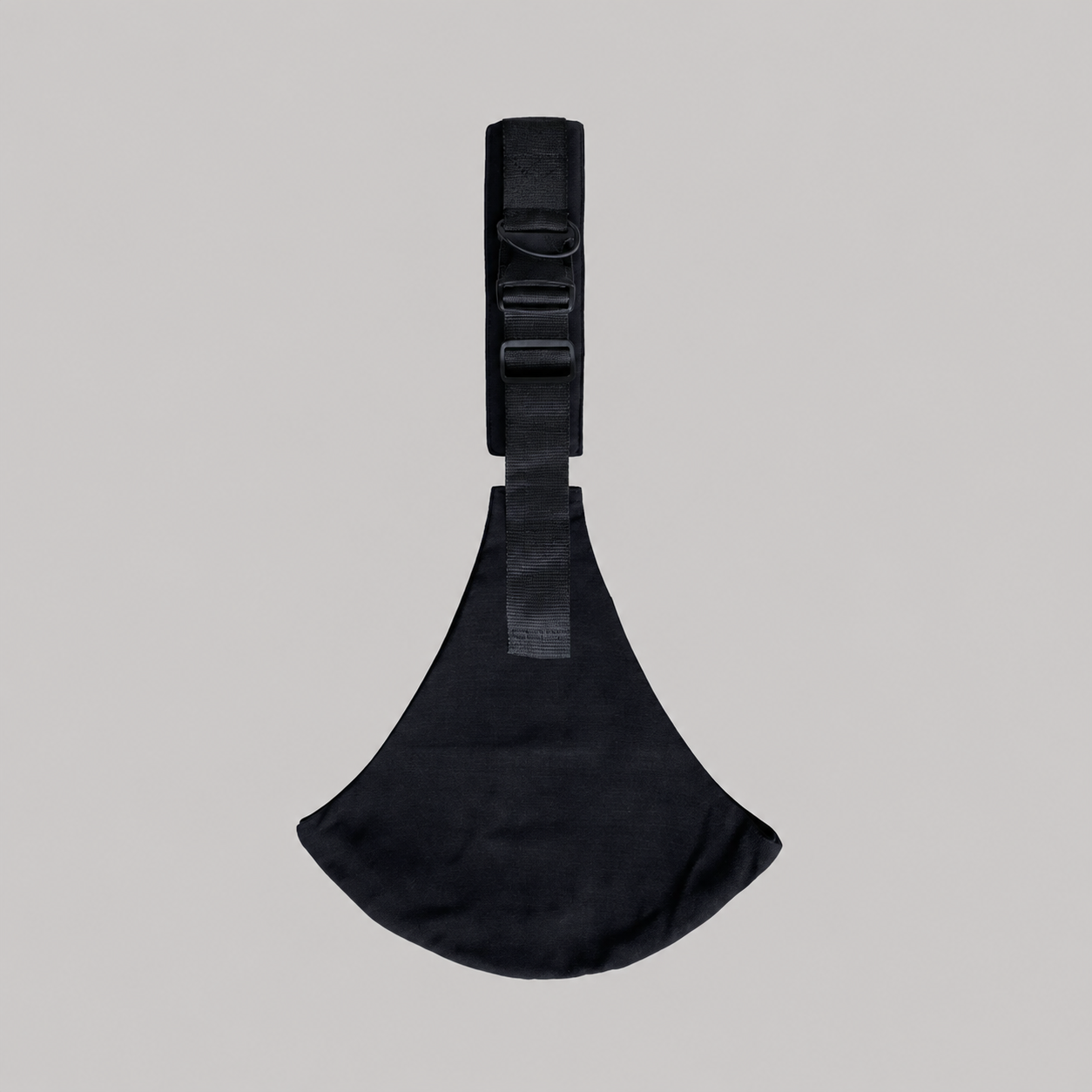 NAEVII Toddler Sling Carrier in black laid flat, full length with padded shoulder strap, side release buckle and rounded seat#Color_Black