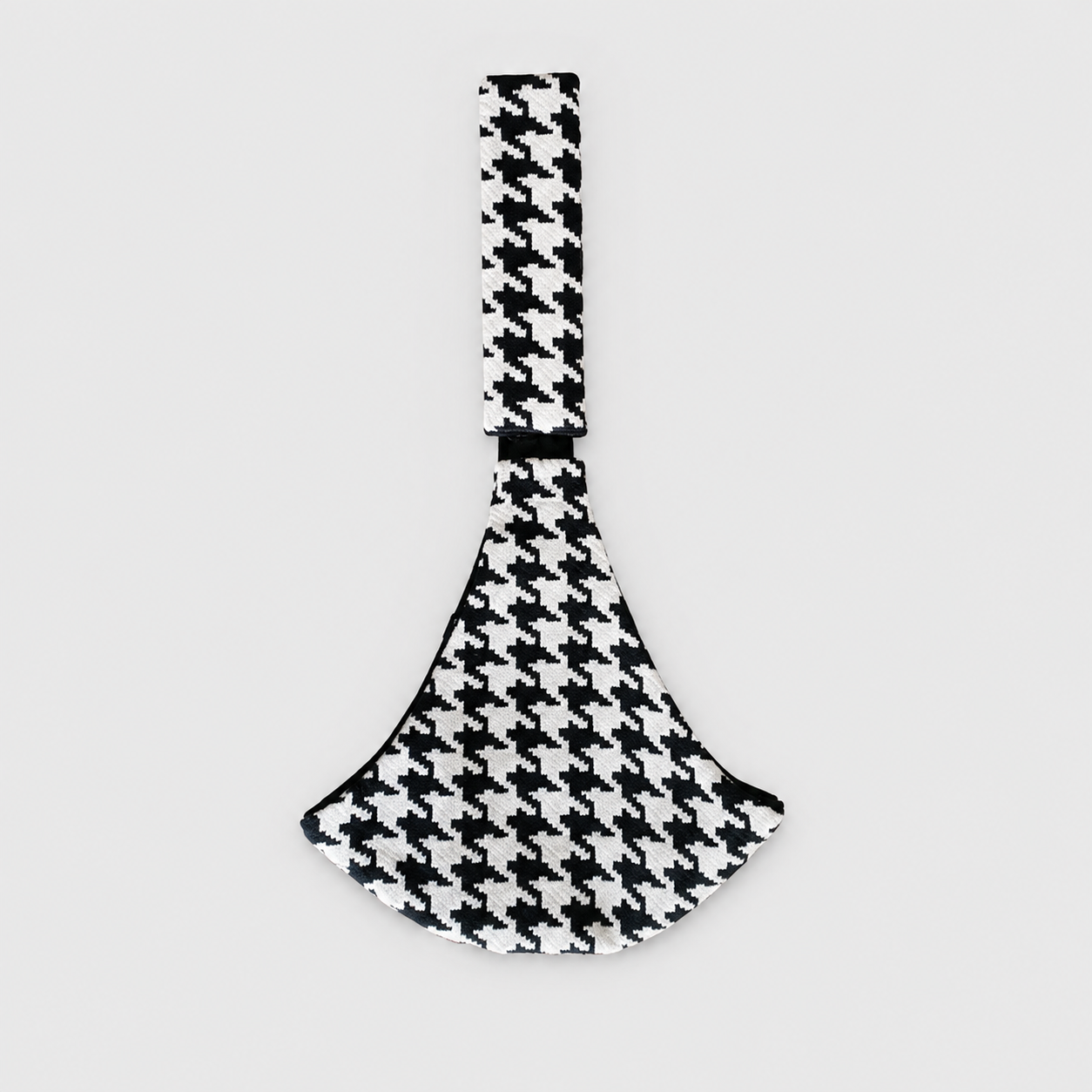 NAEVII Toddler Sling Carrier in black and white Houndstooth laid flat, full length with padded shoulder strap and rounded seat#Color_Houndstooth